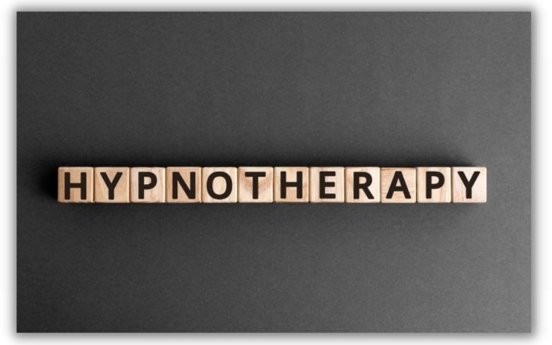 wooden blocks arranged horizontally spelling out hypnotherapy